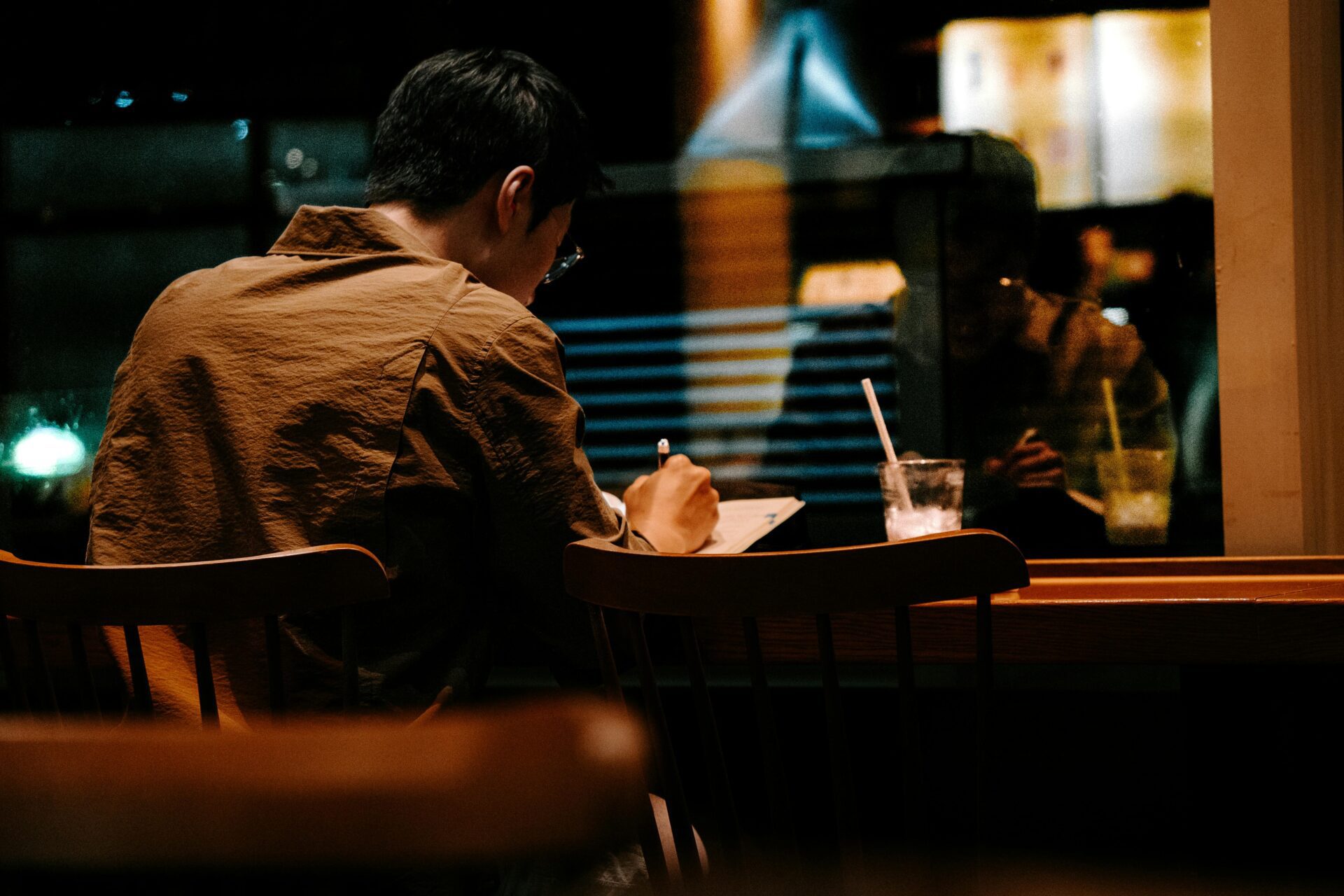 Two woman dressed professionally, working on a laptop together
